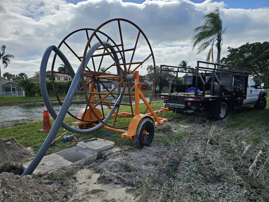Underground utility installation equipment at a construction project site