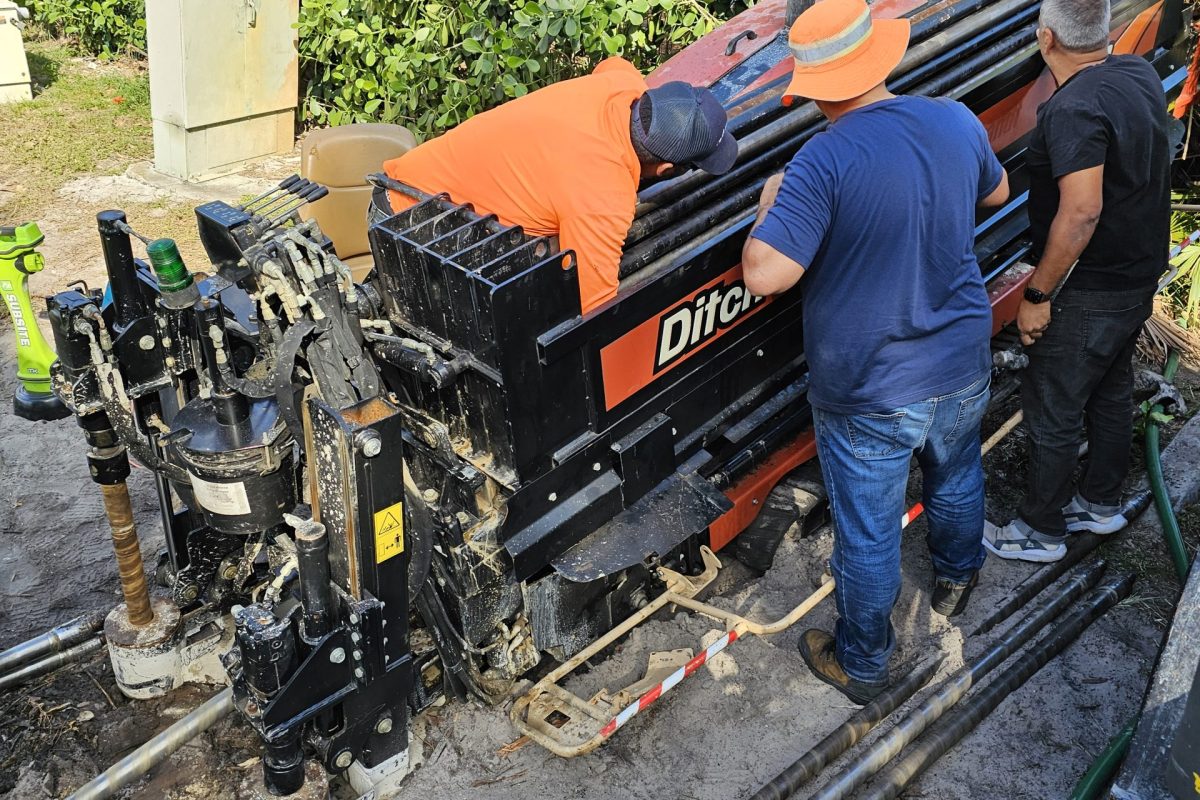 Crew operating horizontal directional drilling equipment for underground utility installation in Palm Beach County, Florida